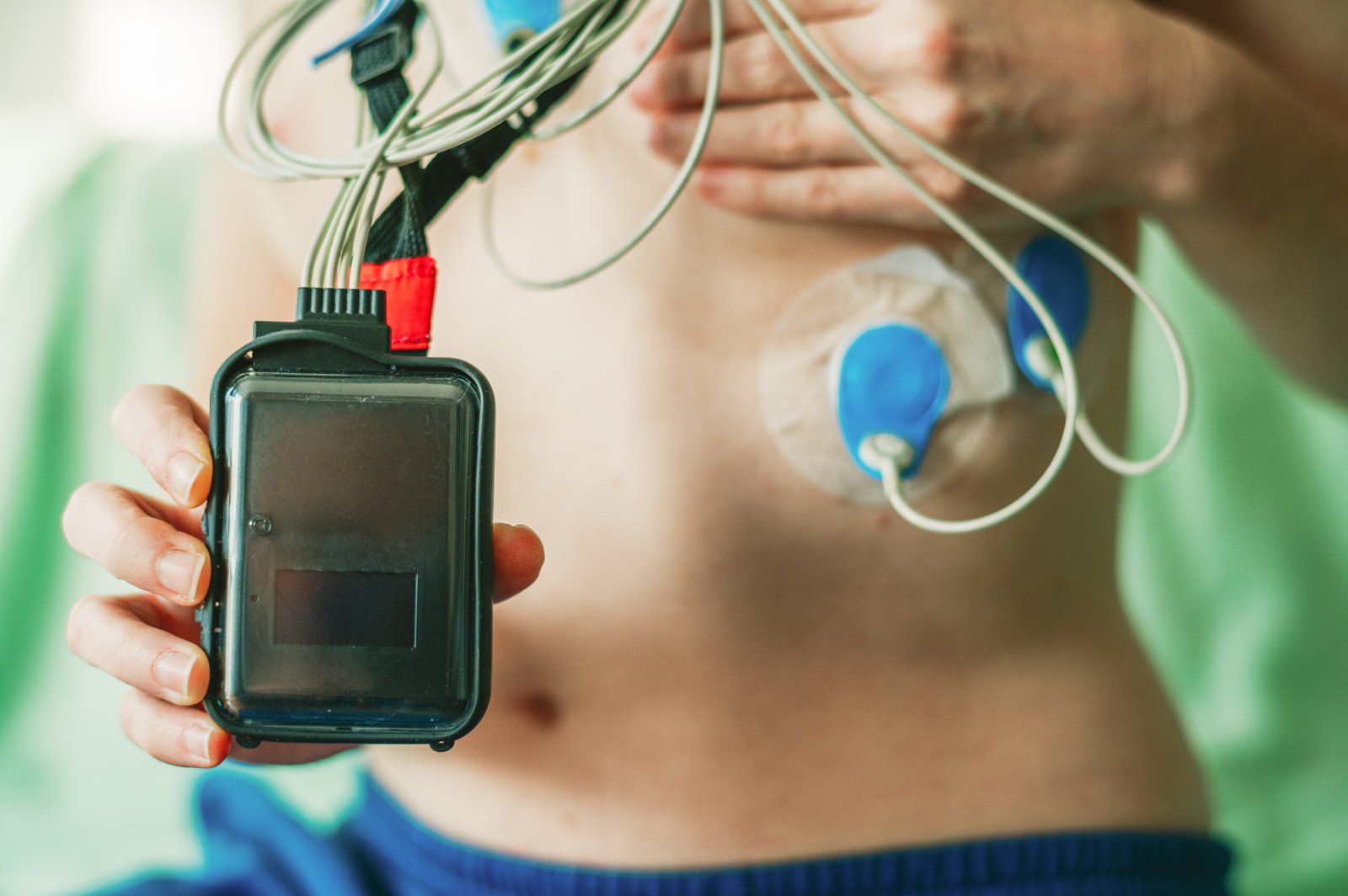 Holter monitor device worn by patient for continuous heart monitoring